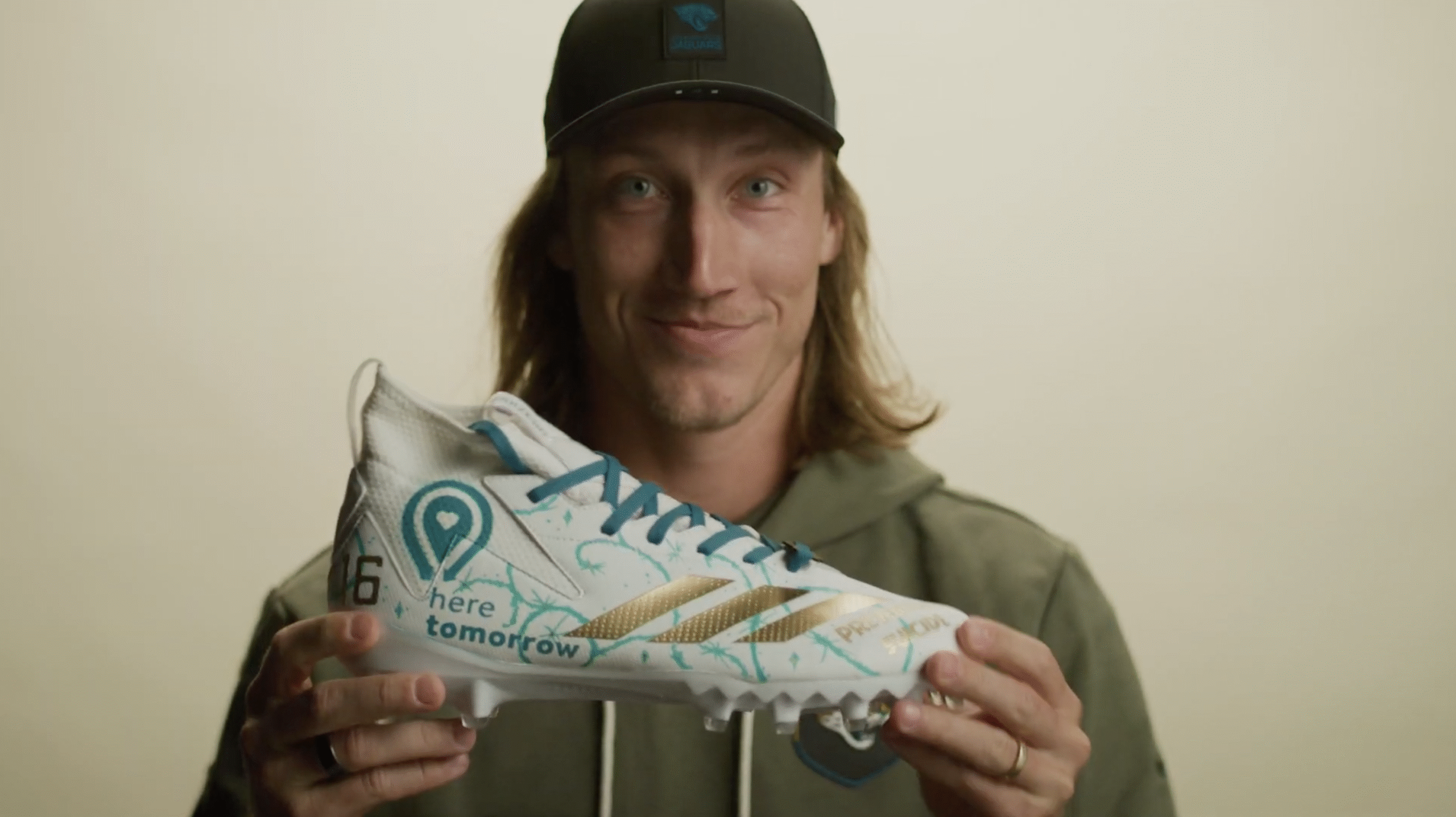 Trevor Lawrence holding cleats for My Cause My Cleats Here Tomorrow 2025