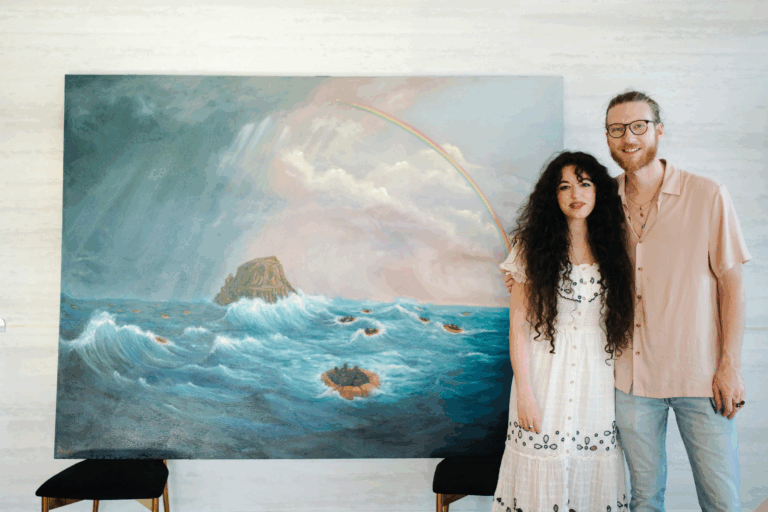 Here Tomorrow Painting with brooke and chase lawrence standing in front